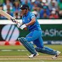 Image result for MS Dhoni Holding Bat