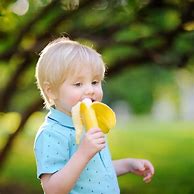 Image result for Boy Eating a Banana