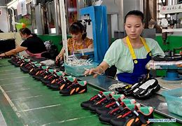 Image result for shoes factory worker