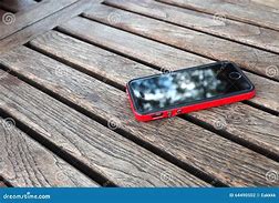 Image result for Red Cell Phone On a Table