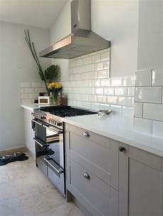 corian tile grey burford kitchen with white corian worktops and subway corian tile grey burford kitchen with white corian worktops and subway