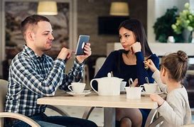 Image result for Two People Looking at Phone