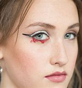 Image result for Girl Doing Eye Liner with Knife