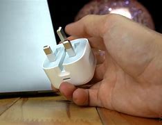 Image result for iPhone Charger in Hand