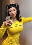 Image result for Cardi B with Yellow Hair and Black and White Suit