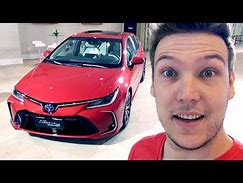 Image result for Toyota Corolla ZR Hybrid Volcanic Red