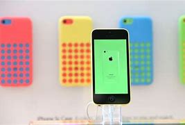 Image result for Yellow iPhones in Cute Cases and Popsockets