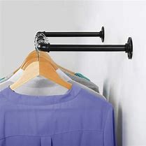 Image result for Adjustable Wall Mounted Clothes Rail