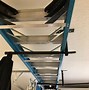 Image result for Ladder Storage Hooks Ceiling