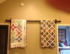 Image result for Pictures of Quilts Hanging From a Curtain Rod with Rings