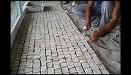 Hand made cobblestone cut and Portuguese pavement laying techniques Roc2c
