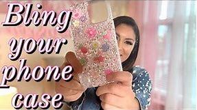 Customize your cell phone case with rhinestones and flatpack charms.