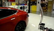 Tesla's new snake-like charger plugs itself in, but is it creepy, sensual or both? – video