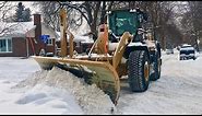 Snow Removal CAT Plowing Deep Snow with Wing
