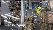 British soldiers seen firing guns on suburban French streets