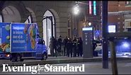 Amsterdam: Hostage drama at Apple store ends as gunman hit by police car
