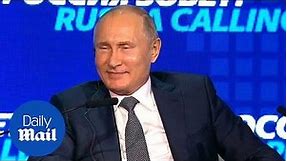 Putin smiles as he asserts his plans to remain Russia's President