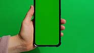 Hands Holding Cell Phone with Green Screen on Green Background Chroma Key Mock Up Mobile Phone