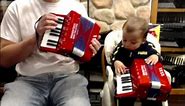 WDTOYPA8R - Red Woodstock Toy Piano Accordion M 17 8 $40