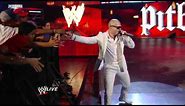 Raw: Pitbull and the Miami Heat dancers join The Rock