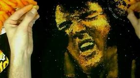 Elvis Presley Painting with Cheese Puffs on Velvet - Cheesy Art in Cheetos
