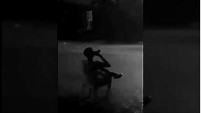 Guy sitting in rain