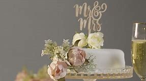 Free stock video - Wedding cake with glasses of champagne against grey studio background at wedding reception 2