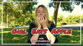 girl eats apple