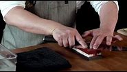 Sharpening a Shun knife on a whetstone