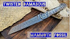 I made a twisted damascus knife with mammoth fossil