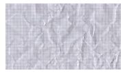 Stop motion texture animation of crumpled grid paper