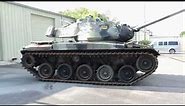 Bob Cat Parking an M41 Walker Bulldog Tank