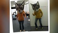 Oversized realistic cat mask makes students look like cat-human hybrids