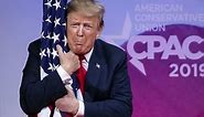 Trump Hugs American Flag at CPAC