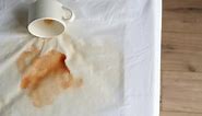 Cup of Coffee Spilled on Bed Top View