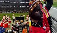 Young KC Chiefs fan with feathered headdress does 'tomahawk chop'