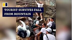 Chinese tourist survives fall from steep mountain steps