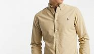 Polo Ralph Lauren icon logo slim fit garment dyed oxford shirt in tan | ASOS