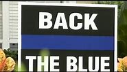 Woman asked to remove 'Back the Blue' sign from yard