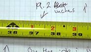 Read a tape measure in feet-inches, markings on the blade