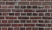 Bare brick wall texture, old, aged bricks, handheld shot