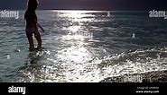 little girl on the sunset beach Stock Video Footage - Alamy