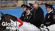 Vladimir Putin rides horse with female police officers ahead of International Women's Day