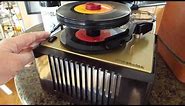 RCA record player. With case. Playing stack of 45 RPM records