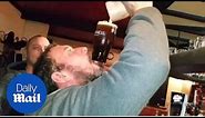Man does amazing pub trick with a pint of Guinness - Daily Mail