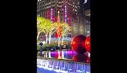 Iconic red Christmas ornaments installed atop Manhattan Fountain