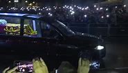 Crowds light phones as the Queen's coffin arrives at Buckingham Palace