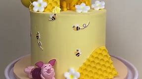 Winnie The Pooh cake 🍯🐝 How adorable is this cake by @yoras.cakes?! Judit used Colour Mill Lemon to colour her buttercream and topped with our Winnie The Pooh and friends cake toppers. All supplies available at The Cake Decorating Co. Shop now - https://bit.ly/44cY1fK | The Cake Decorating Company