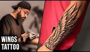 Realistic Wings Tattoo on Forearm
