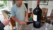 Opening biggest wine bottle and decanting